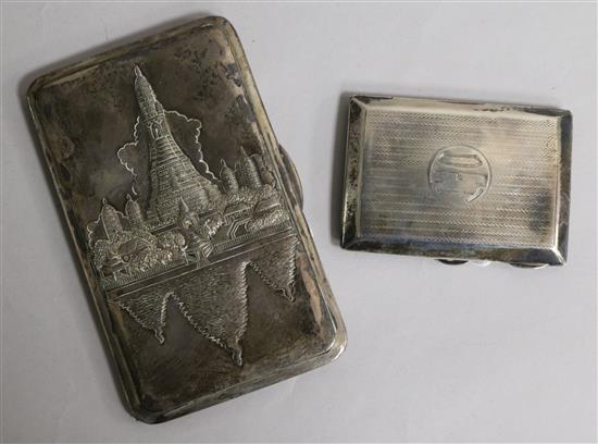An embossed white metal cigarette case, with presentation inscription, Bangkok 1946 and an engine-turned silver cigarette case